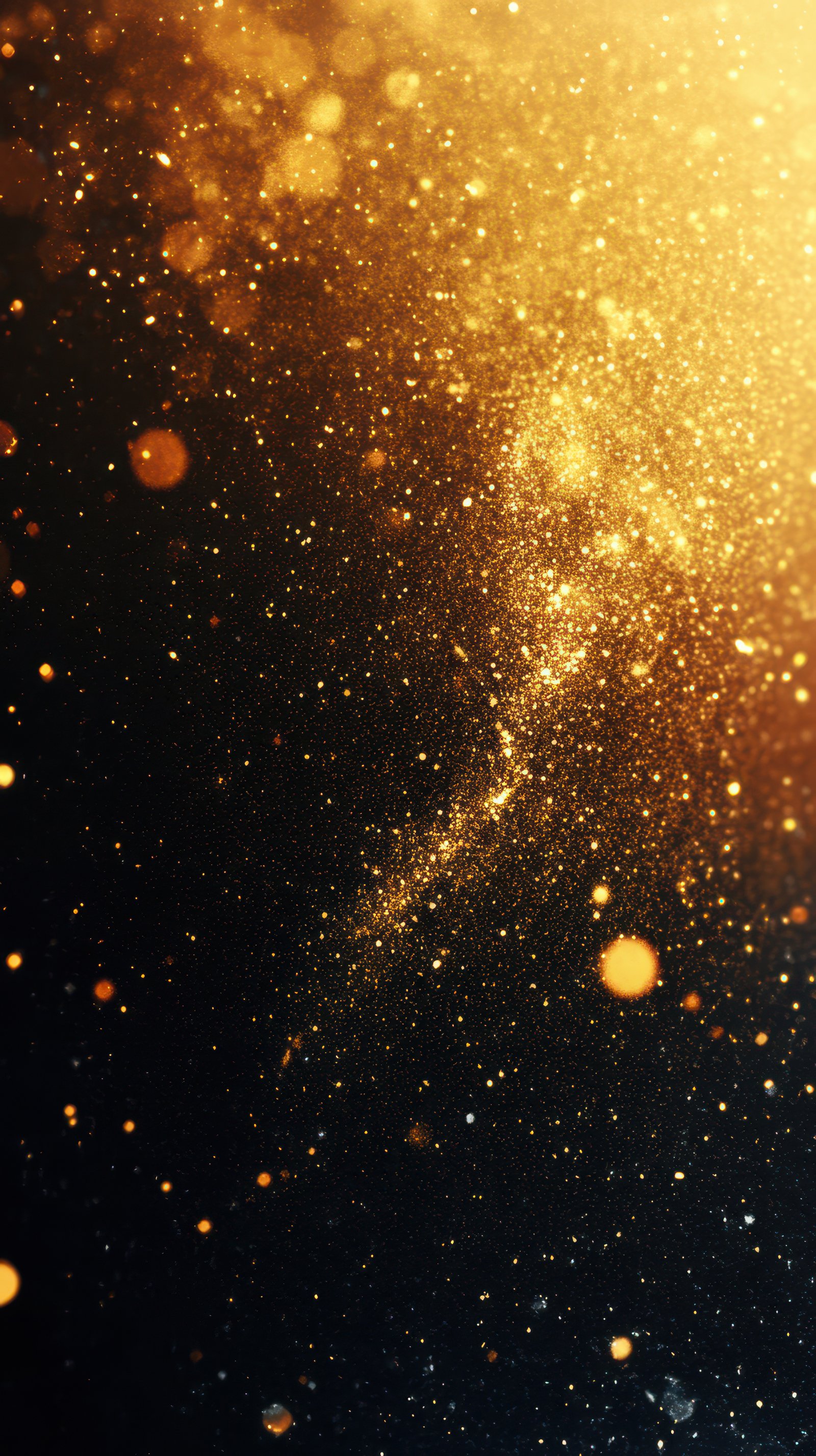 Golden sparkles create a mesmerizing pattern in an abstract light display during a festive celebration at night